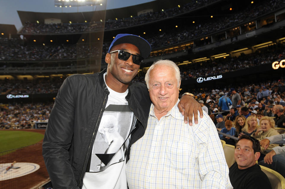 Kobe Bryant of the Los Angeles Lakers and Tommy Lasorda attend a game between the Los Angeles Dodgers and the New York Yankees on July 31, 2013 at Dodger Stadium in Los Angeles, Caifornia. (Photo by Jill Weisledero/Los Angeles Dodgers via Getty Images)