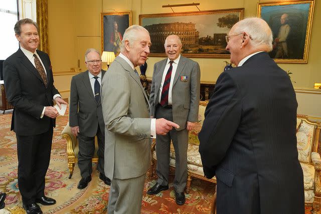 <p>Jonathan Brady - WPA Pool/Getty Images</p> King Charles meets Korean War veterans on March 19, 2024.