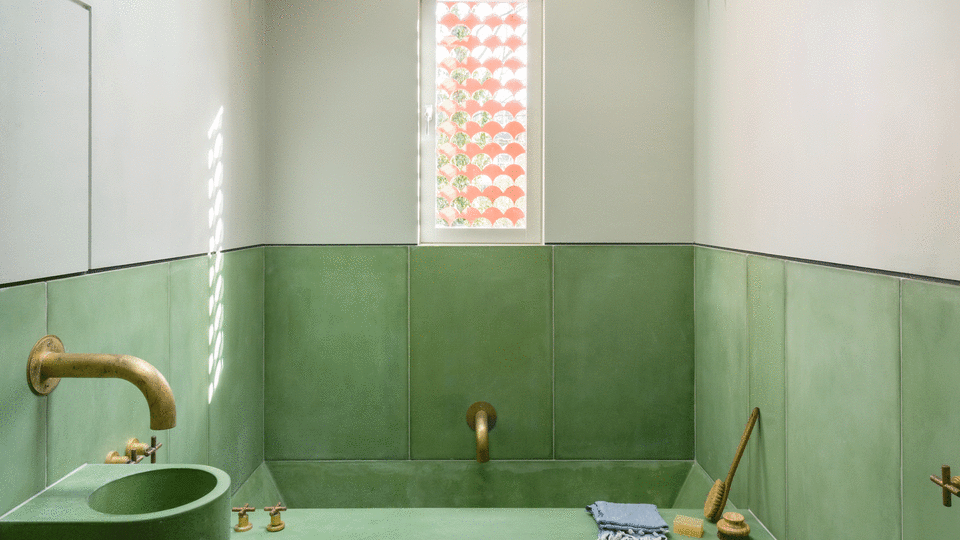 Concrete bathroom with a green bottom half