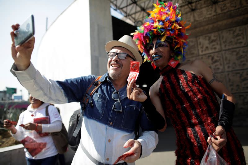 Polo Gomez, also known as drag queen Yolanda la del Rio, from organization Condomovil A.C., poses for a selfie during an event organized by AIDS Healthcare Foundation for the International Condom Day, in Mexico City