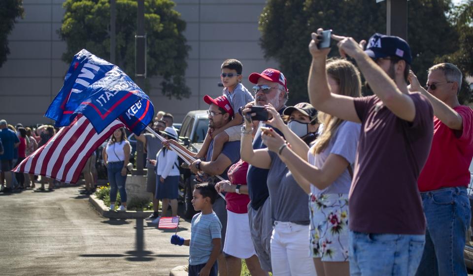 Supporters cheer on President Trump as he departs on Air Force One from Santa Ana.