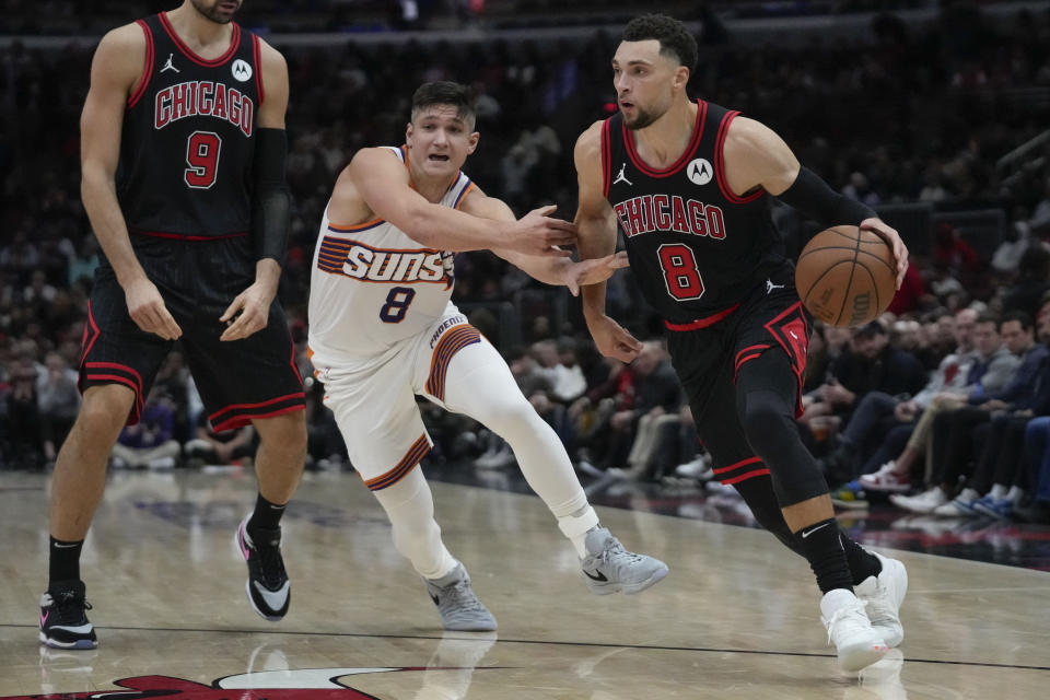 Phoenix Suns guard Grayson Allen, left, chases after Chicago Bulls guard Zach LaVine during the second half of an NBA basketball game, Wednesday, Nov. 8, 2023, in Chicago. (AP Photo/Erin Hooley)