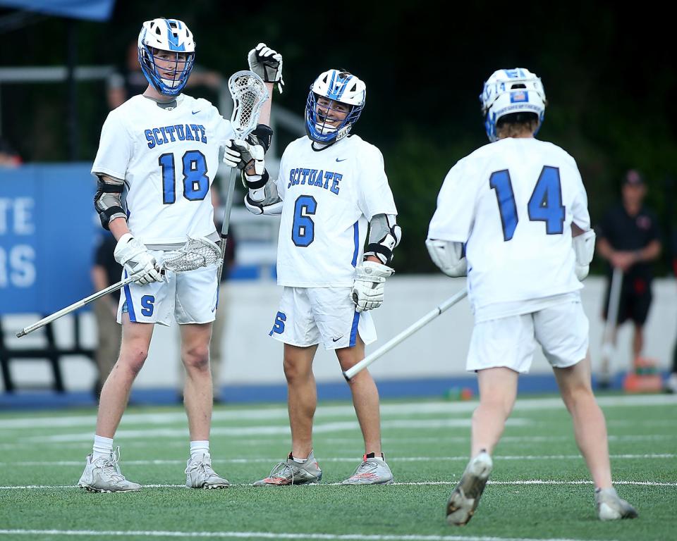 Scituate's James Sullivan and Scituate's Quinn DeCourcey are all smiles after James scored a goal to give Scituate the 7-1 lead during first quarter action of their game against Whitman-Hanson in the Round of 32 of the Division 2 state tournament at Scituate High School on Tuesday, June 7, 2022. 