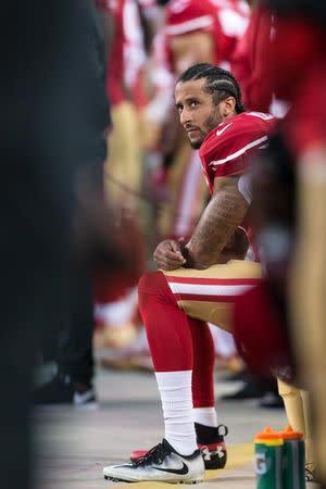 Sep 12, 2016; Santa Clara, CA, USA; San Francisco 49ers quarterback Colin Kaepernick (7) sits during the national anthem before the game against the Los Angeles Rams at Levi's Stadium. Mandatory Credit: John Hefti-USA TODAY Sports