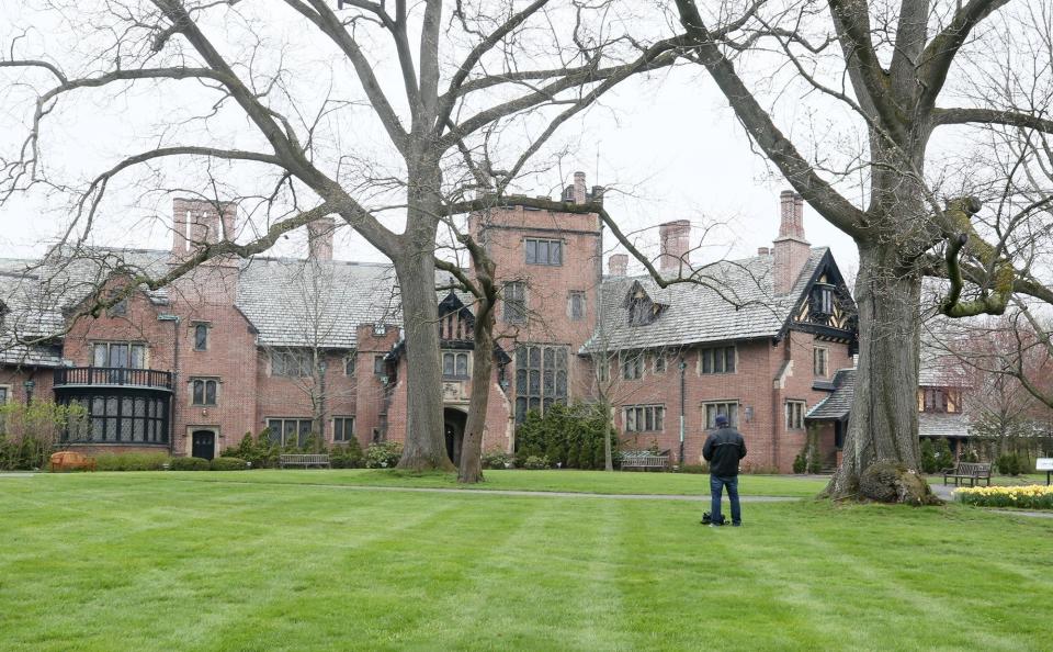 David Cebula, sketches the front of the manor as he enjoys his day off at Stan Hywet Hall & Gardens on Friday April 24, 2020.