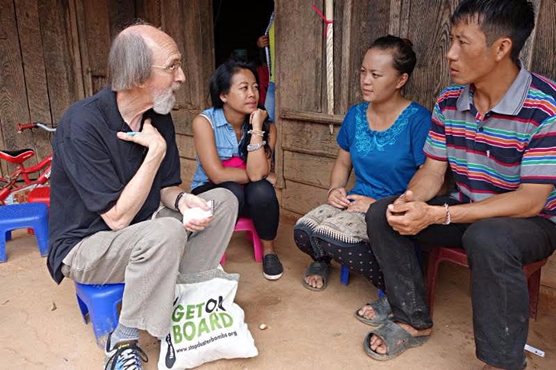 In northeastern Laos in 2017, Legacies of War Board Chairman Titus Peachey and Executive Director Channapha Khamvongsa meet with the parents of Lab Lee, a 10-year-old girl killed by a U.S. cluster bomb just six weeks earlier.