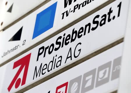 The logo of Germany's biggest commercial broadcaster ProSiebenSat.1 Media AG is pictured next to their headquarters in Unterfoehring, near Munich, Germany in this February 26, 2014 file photo. REUTERS/Michaela Rehle