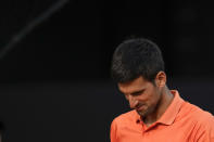 Novak Djokovic reacts during a men's semifinal match against Carlos Alcaraz at the Mutua Madrid Open tennis tournament in Madrid, Spain, Saturday, May 7, 2022. (AP Photo/Manu Fernandez)