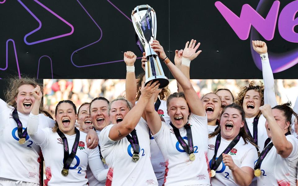 Marlie Packer and Zoe Aldcroft lift the Six Nations trophy