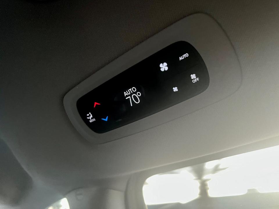 The temperature control on the ceiling of the Waymo minivan.