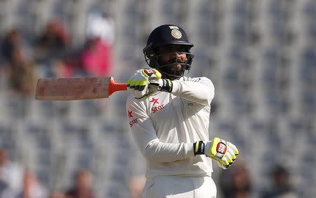 Cricket - India v England - Third Test cricket match - Punjab Cricket Association Stadium, Mohali - 28/11/16. India's Ravindra Jadeja celebrates his half century. REUTERS/Adnan Abidi