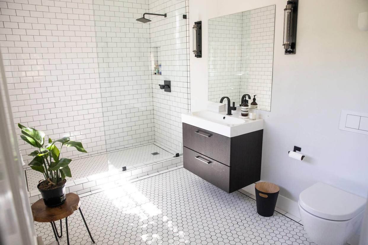 White tile bathroom with sunlight