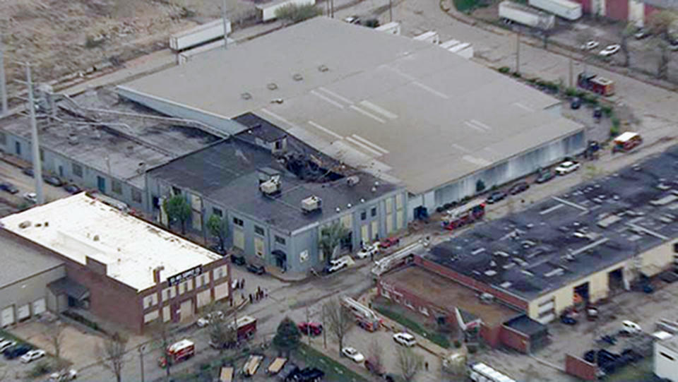 This Monday, April 3, 2017 photo from video provided by KMOV shows damage to the roof of a box company in St. Louis after a boiler exploded and flew before crashing through the roof of a nearby laundry business. Authorities said several people were killed as a result of the explosion. (KMOV via AP)