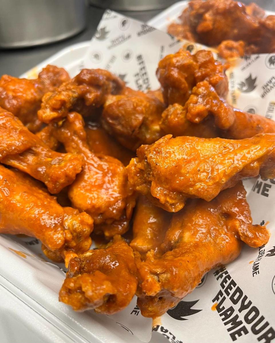 Golden Flame Hot Wings serves boneless and bone-in chicken wings with your choice of sauces or rubs, as well as fries and other sides.