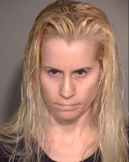 Amy Atkisson was arrested after authorities said she pepper-sprayed a protester.