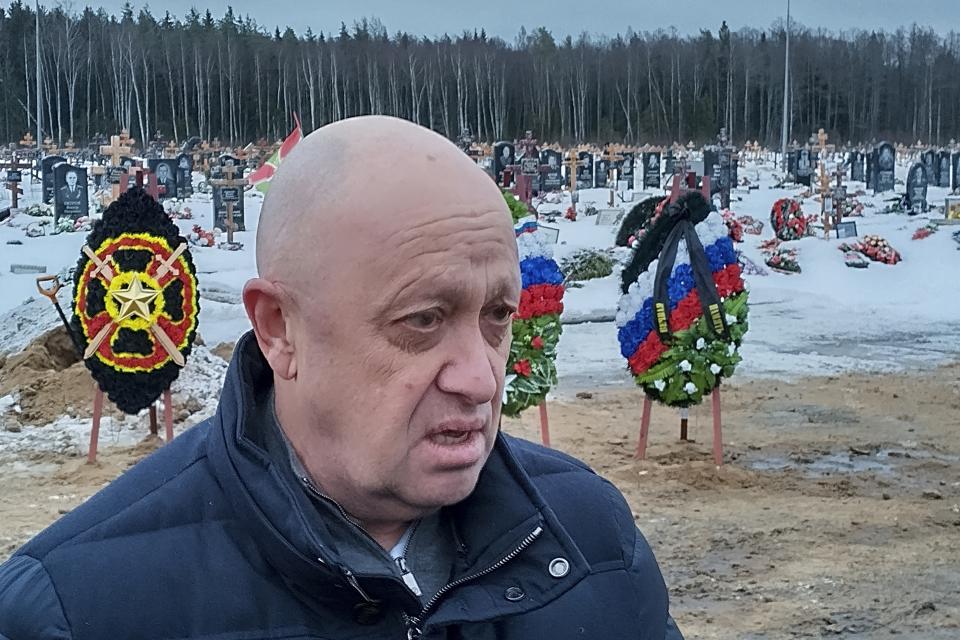 FILE - Wagner Group head Yevgeny Prigozhin attends the funeral of Dmitry Menshikov, a fighter of the Wagner group who died during a special operation in Ukraine, at the Beloostrovskoye cemetery outside St. Petersburg, Russia, on Dec. 24, 2022. Prigozhin made his name as the profane and brutal mercenary boss who mounted an armed rebellion that was the most severe and shocking challenge to Russian President Vladimir Putin’s rule. (AP Photo/File)
