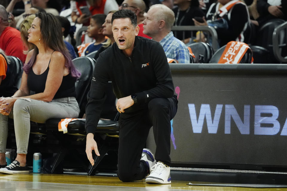 Phoenix Mercury head coach Nate Tibbetts shouts instructions during the first half of a WNBA basketball game against the Indiana Fever, Sunday, June 30, 2024, in Phoenix. The Fever won 88-82. (AP Photo/Ross D. Franklin)