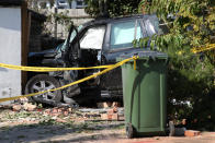 The scene of a collision in Broad Walk, Kidbrooke, south-east London, where the driver of a lorry which hit two cars before crashing into a house has died and an 11-year-old child is in a life-threatening condition in hospital.