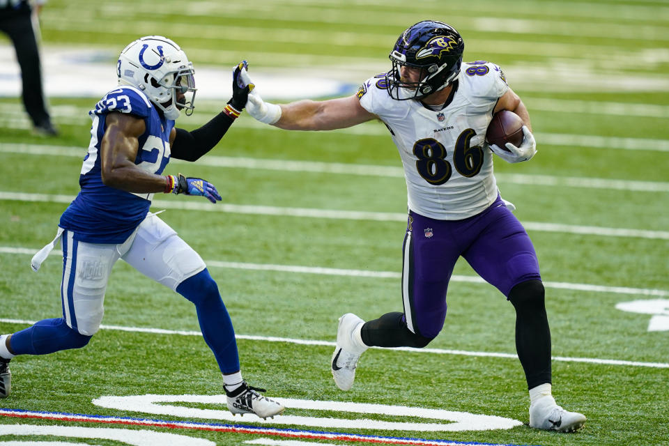 Baltimore Ravens tight end Nick Boyle (86) holds off Indianapolis Colts cornerback Kenny Moore II (23) in the second half of an NFL football game in Indianapolis, Sunday, Nov. 8, 2020. (AP Photo/Darron Cummings)