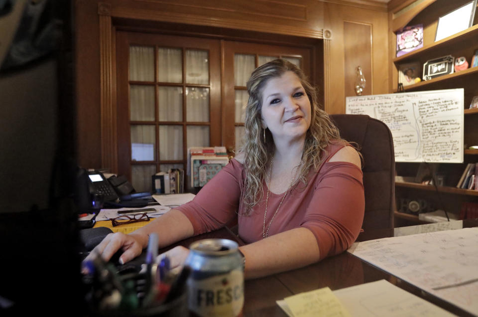 Coral Nichols, vice president and co-founder of Empowered to Change Inc., poses for a photograph in her office Wednesday, Nov. 7, 2018, in Seminole, Fla. Coral is one of around 1.4 million Floridians who stand to get their voting rights back after serving their time for committing a felony. Florida added 1.4 million possible voters to the rolls when it passed Amendment 4 Tuesday, which said most felons will automatically have their voting rights restored when they complete their sentences and probation. (AP Photo/Chris O'Meara)