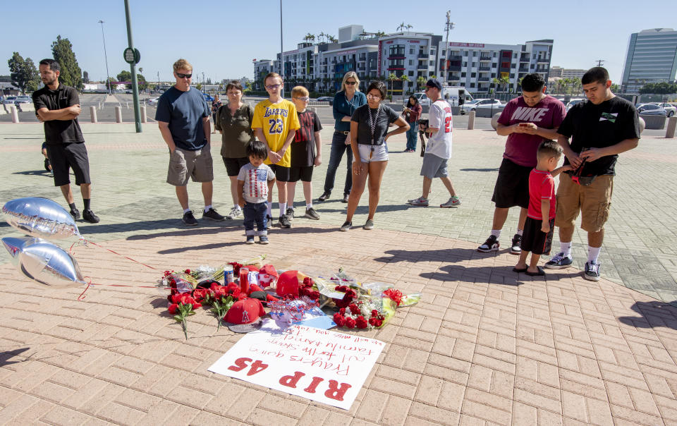 Mourners gather around aa memorial for Angel pitcher Tyler Skaggs outside Angel Stadium in Anaheim on Monday, July 1, 2019. Skaggs died in Texas at the age of 27. (Photo by Leonard Ortiz/MediaNews Group/Orange County Register via Getty Images)