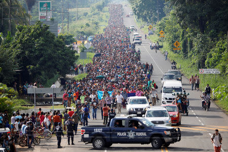 Central American migrants walk along the highway near the border with Guatemala, as they continue their journey trying to reach the U.S., in Tapachula, Mexico October 21, 2018. REUTERS/Ueslei Marcelino