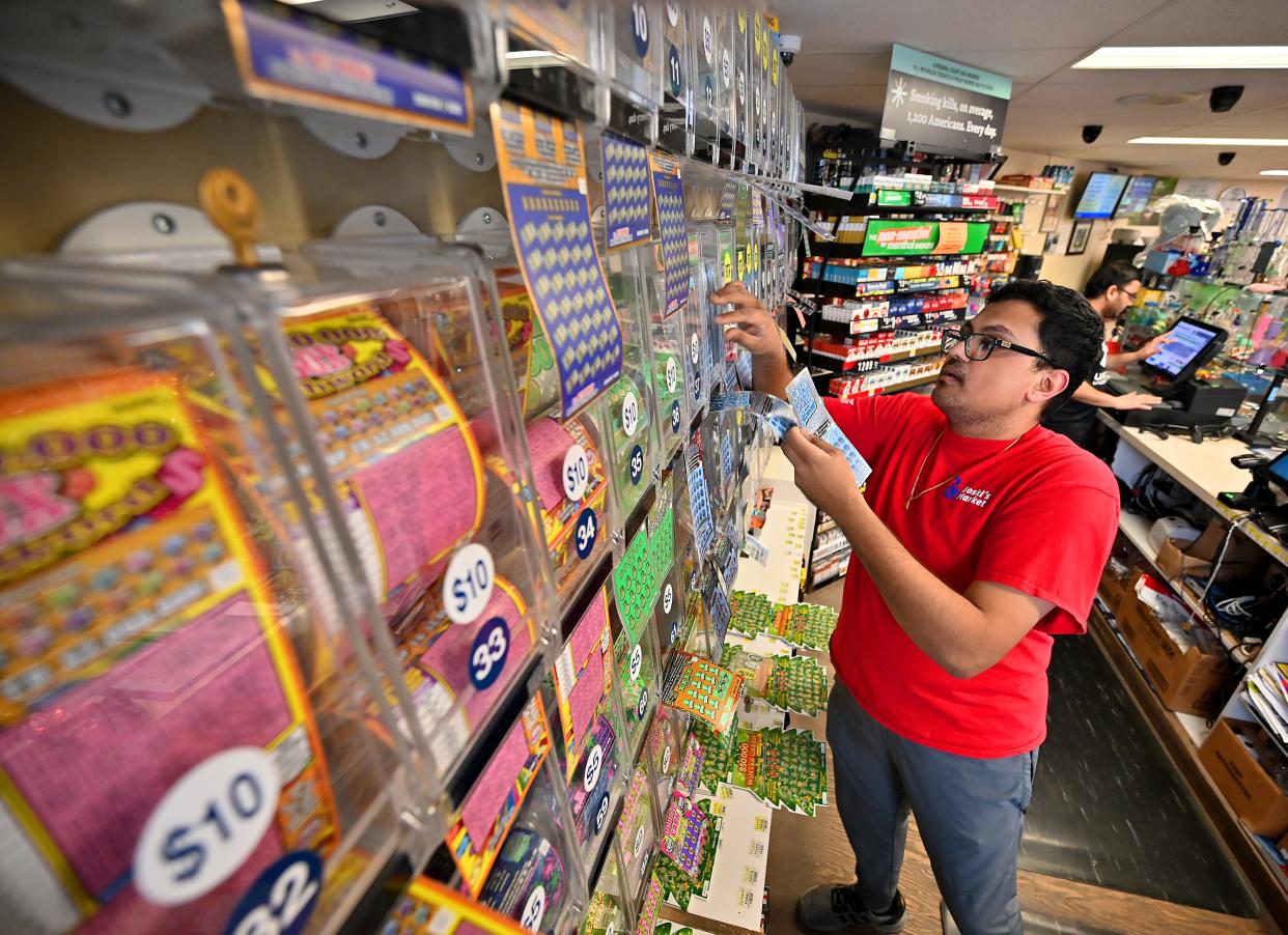 Drew Patel refills scratch tickets at Boski's Market in Worcester.