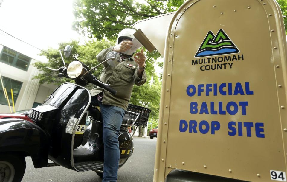 Drop boxes can be a helpful alternative to mailboxes for people who prefer not to buy postage or who are voting at the last minute. <a href="https://newsroom.ap.org/detail/Election2020VoteByMailOregon/676bbd6939e64809be1cccf6d10d154e/photo" rel="nofollow noopener" target="_blank" data-ylk="slk:AP Photo/Don Ryan;elm:context_link;itc:0;sec:content-canvas" class="link ">AP Photo/Don Ryan</a>