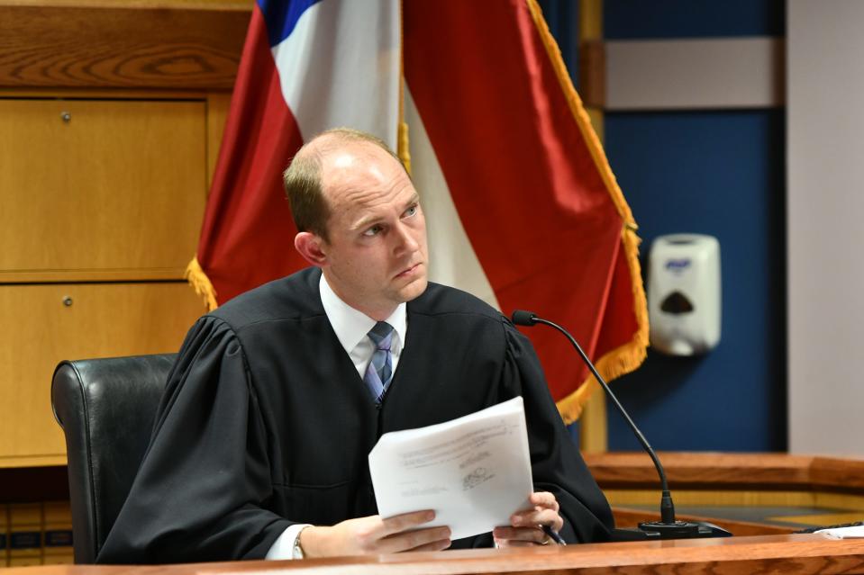 Fulton County Superior Court Judge Scott McAfee presides during a hearing regarding defendant Harrison Floyd, a leader in the organization Black Voices for Trump, as part of the Georgia election indictments, Tuesday, Nov. 21, 2023, in Atlanta. McAfee heard arguments Tuesday on a request to revoke Floyd's bond, of one of former President Donald Trump's co-defendants in the Georgia case related to efforts to overturn the 2020 election. Fulton County District Attorney Fani Willis, in a motion filed last week, says that Floyd has been attempting to intimidate and contact likely witnesses and his co-defendants in violation of the terms of his release.