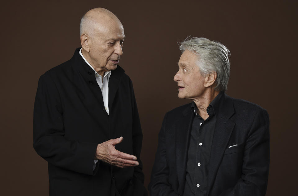 In this Nov. 7, 2018 photo, Alan Arkin, left, and Michael Douglas, cast members in the Netflix comedy series "The Kominsky Method," appear at the Beverly Wilshire Four Seasons hotel in Beverly Hills, Calif. The pair play Hollywood veterans facing the indignities of aging in a change-of-pace comedy-drama from sitcom hitmaker Chuck Lorre. (Photo by Chris Pizzello/Invision/AP)