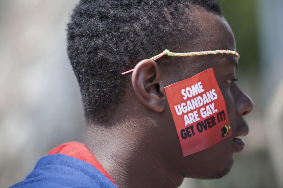 A Ugandan man is seen during the third Annual Lesbian, Gay, Bisexual and Transgender (LGBT) Pride celebrations on Aug. 9, 2014 in Entebbe, Uganda. (Photo by AP Photo/Rebecca Vassie, File)