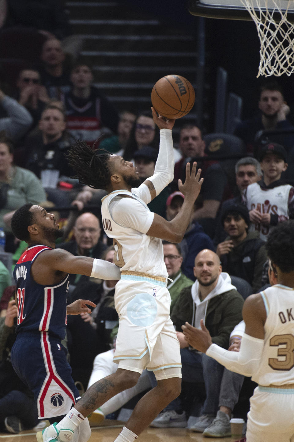 Cleveland Cavaliers' Darius Garland (10) shoots as Washington Wizards' Monte Morris (22) defends during the first half of an NBA basketball game in Cleveland, Friday, March 17, 2023. (AP Photo/Phil Long)