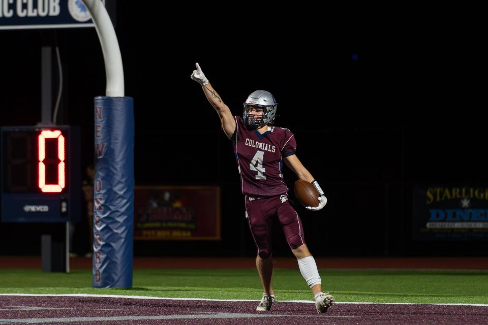 Brennan Holmes celebrates a touchdown for New Oxford against Eastern York.