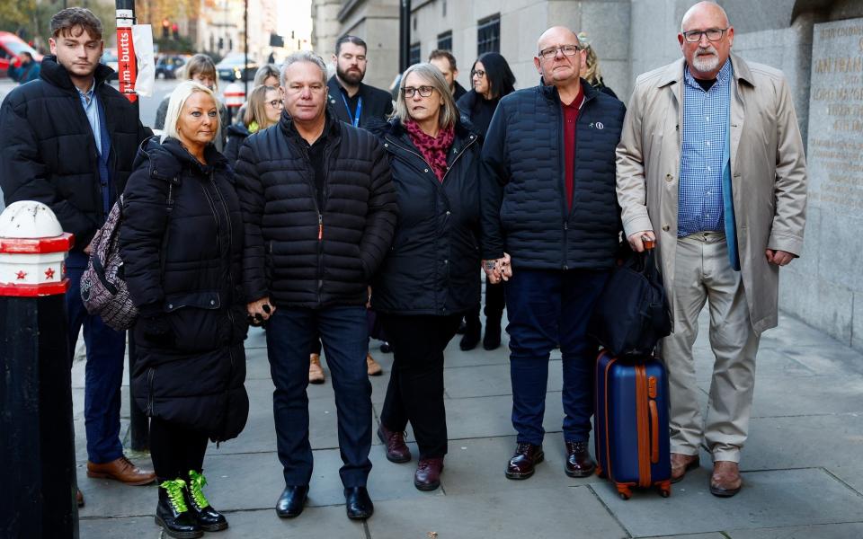 Harry Dunn's mother, Charlotte Charles and her husband Bruce stand with Harry Dunn's father, Tim Dunn, as they attend the old Bailey for the sentencing of Anne Sacoolas - PETER NICHOLLS