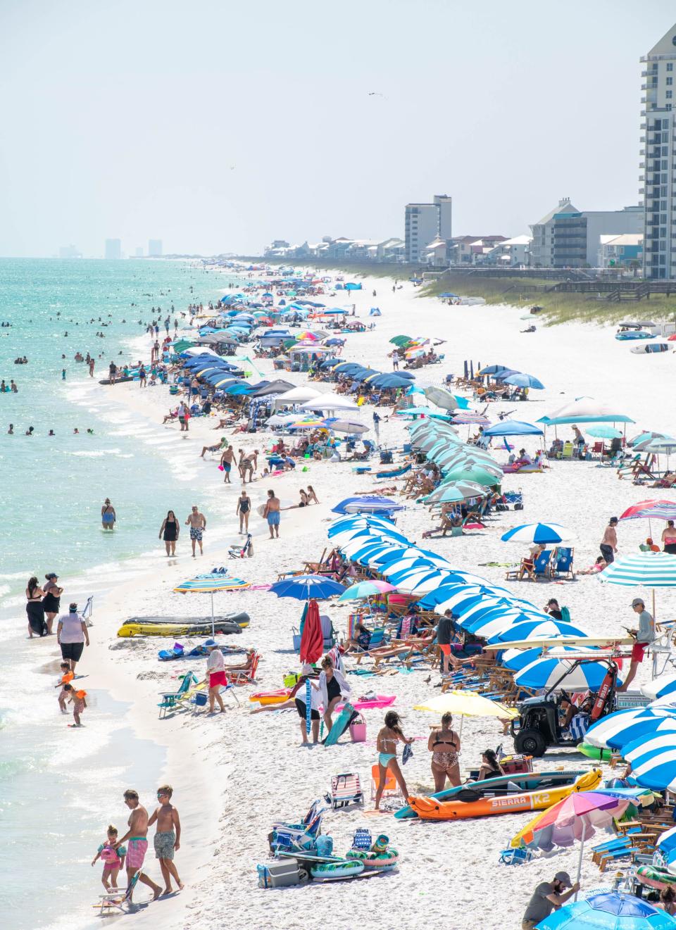 Visitors line the shore in Navarre Beach on Monday, May 22, 2023.