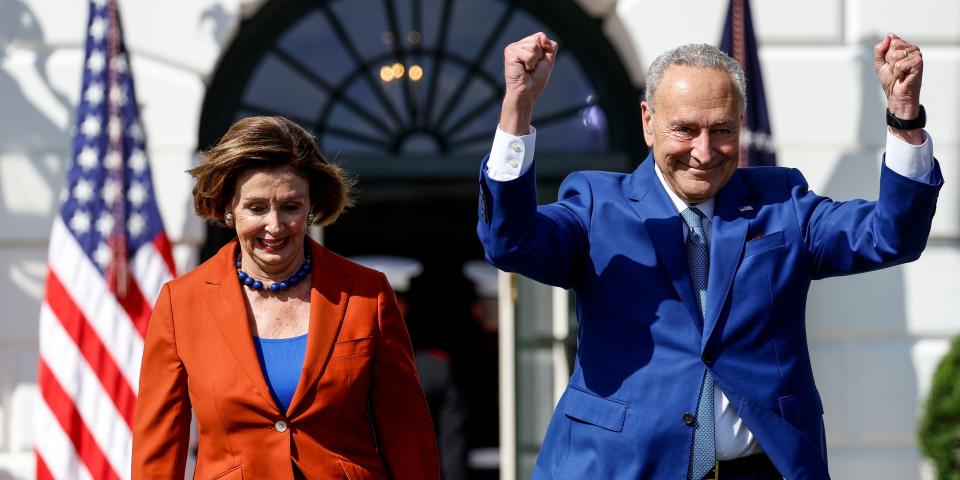U.S. Speaker of the House Nancy Pelosi and Senate Majority Leader Chuck Schumer arrive to an event celebrating the passage of the Inflation Reduction Act on the South Lawn of the White House.