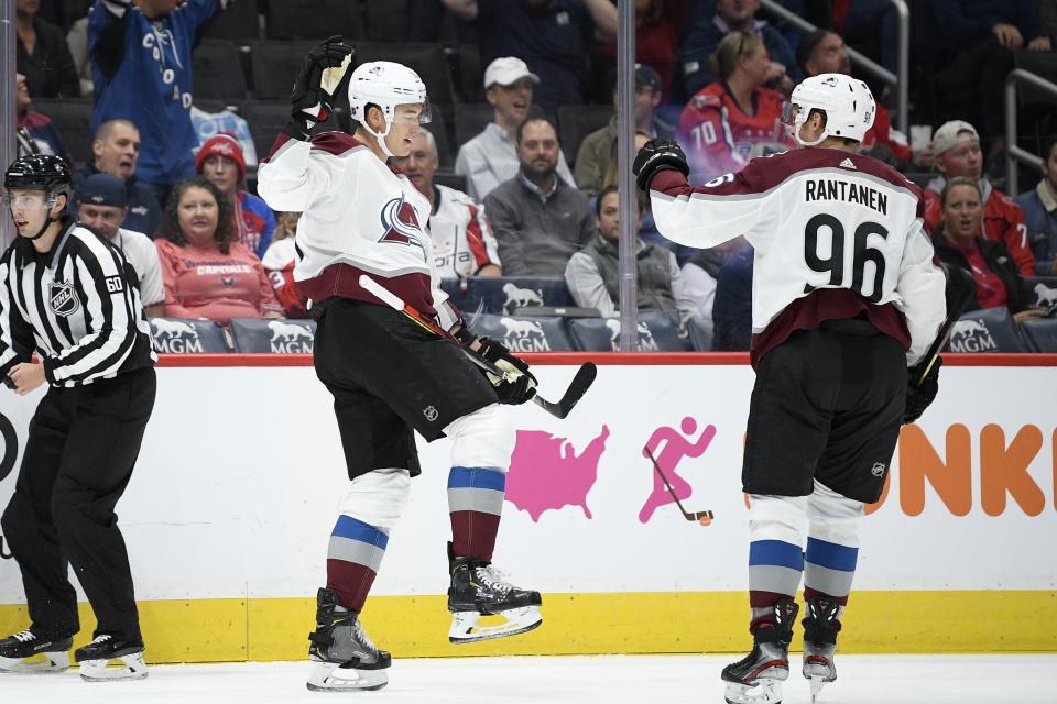 Colorado Avalanche defenseman Nikita Zadorov, left, of Russia, celebrates his goal with right wing Mikko Rantanen (96) during the first period of an NHL hockey game against the Washington Capitals, Monday, Oct. 14, 2019, in Washington. (AP Photo/Nick Wass)