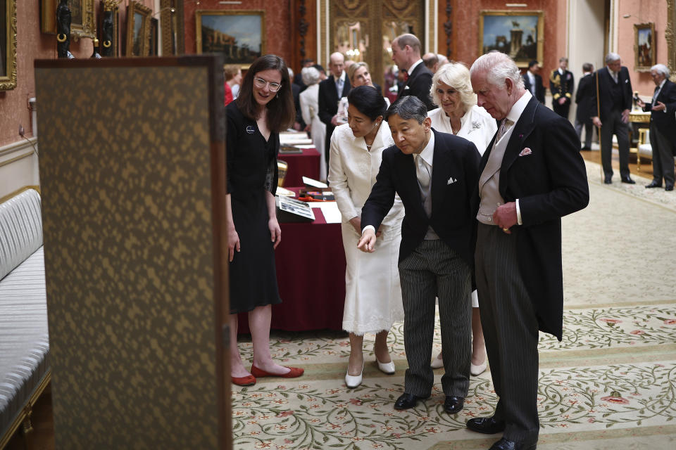 Britain's King Charles III walks with Japan's Emperor Naruhito, followed by Britain's Queen Camilla and Japan's Empress Masako as they view a display of Japanese items from the Royal Collection, in the Picture Gallery at Buckingham Palace in London, Tuesday, June 25, 2024, on the first day of their three-day State Visit to Britain. The Japanese royal couple arrived in Britain for a three-day state visit hosted by King Charles III. (Henry Nicholls/pool photo via AP)