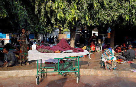 FILE PHOTO: Patients and their attendants wait outside the Out Patient Department (OPD) at a government-run hospital in New Delhi, India, November 22, 2017. REUTERS/Saumya Khandelwal/File photo