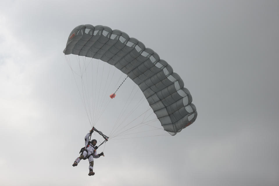 VARIOUS CITIES, MEXICO - SEPTEMBER 16: A Parachuter of the Mexican army takes part in the Independence Day military parade at Zocalo Square on September 16, 2020 in Various Cities, Mexico. This year El Zocalo remains closed for general public due to coronavirus restrictions. Every September 16 Mexico celebrates the beginning of the revolution uprising of 1810. (Photo by Hector Vivas/Getty Images)