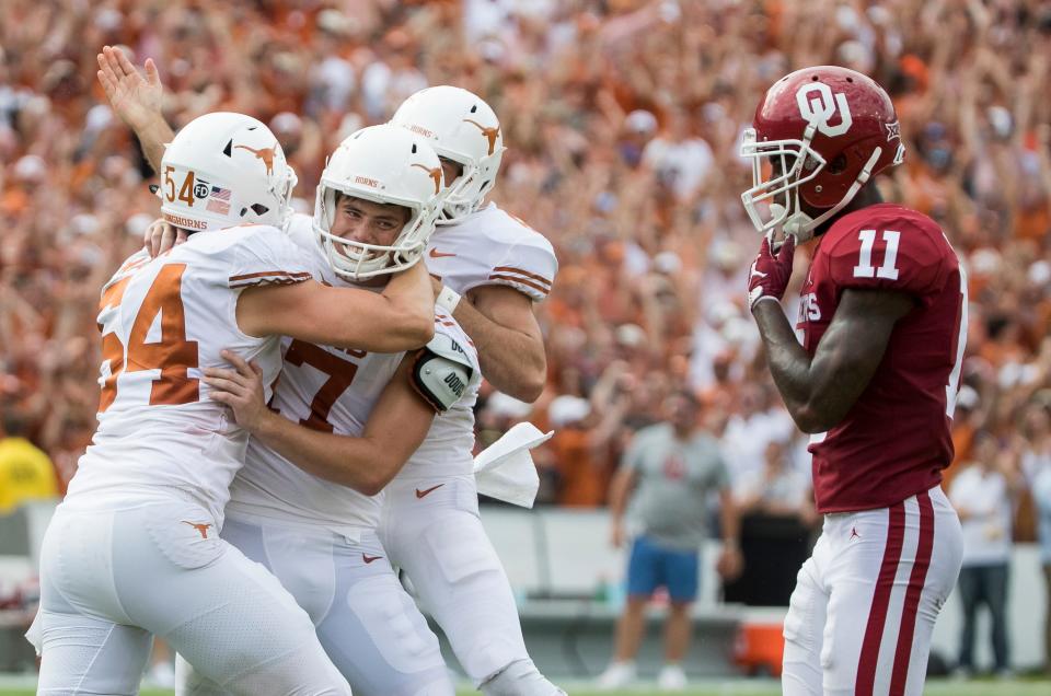 Texas kicker Cameron Dicker celebrates with teammates his game-winning field goal in the Longhorns' 48-45 win over Oklahoma in the 2018 game. The Sooners won the rematch in that year's Big 12 championship game, however.