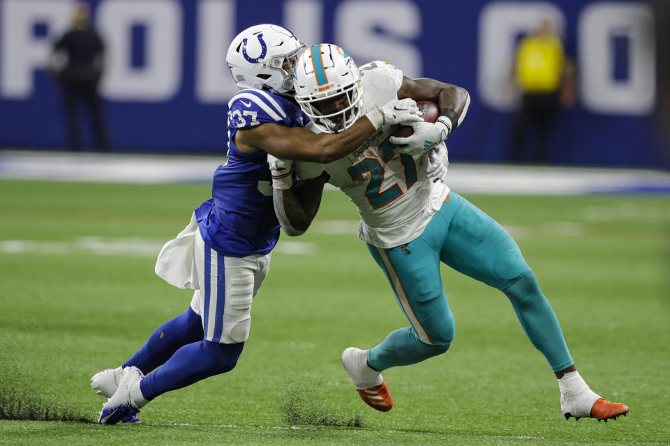 Indianapolis Colts safety Khari Willis (37) tackles Miami Dolphins running back Kalen Ballage (27) during the second half of an NFL football game in Indianapolis, Sunday, Nov. 10, 2019. (AP Photo/Darron Cummings)