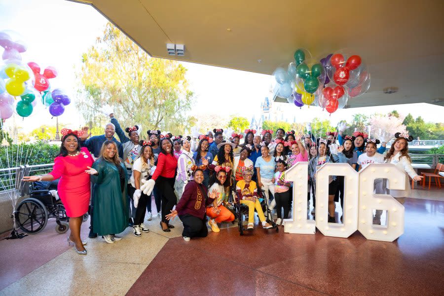 Magnolia Jackson, who wanted to celebrate her 106th birthday at Walt Disney World Resort in Lake Buena Vista, Fla., after seeing Mickey Mouse perform recently in his drum major uniform at a college football game, is warmly greeted Wednesday by Mickey Mouse and the Walt Disney World Ambassadors as she arrived at Magic Kingdom for the first time. Born March 14, 1918 and the oldest living graduate of Bethune-Cookman University in nearby Daytona Beach, Florida, Jackson was showered in birthday wishes and admiration by Disney cast members and executives before she went off to enjoy the parks, visiting with Princess Tiana and experiencing the EPCOT International Flower & Garden Festival. (Bennett Stoops, Photographer)