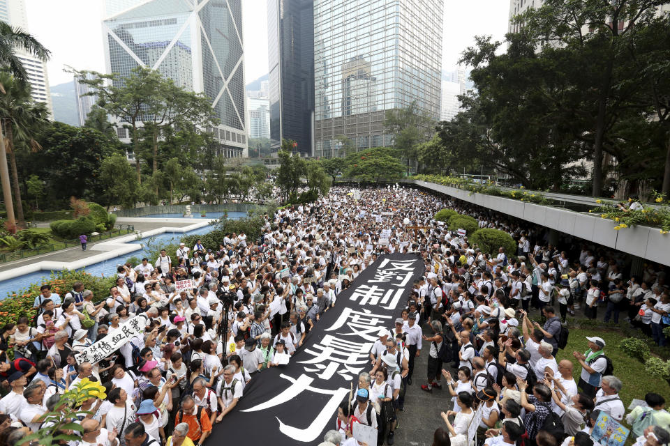 Elderly Hong Kong residents with a banner that reads "Against institutional violence" during a march in Hong Kong on Wednesday, July 17, 2019. Some 2,000 Hong Kong senior citizens, including a popular actress, marched Wednesday in a show of support for youths at the forefront of monthlong protests against a contentious extradition bill in the semi-autonomous Chinese territory.(AP Photo)