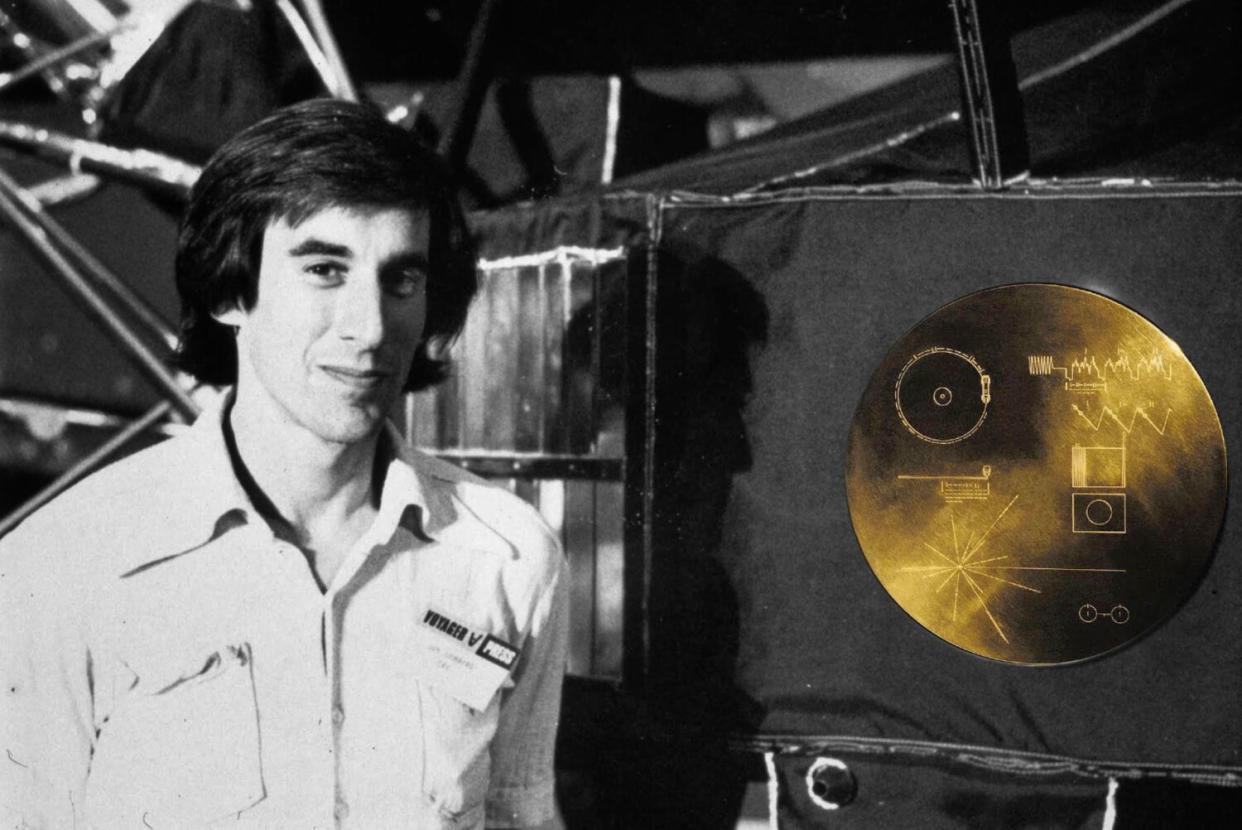 Artist Jon Lomberg stands with a replica of the Golden Record at NASA's Jet Propulsion Laboratory in 1981.