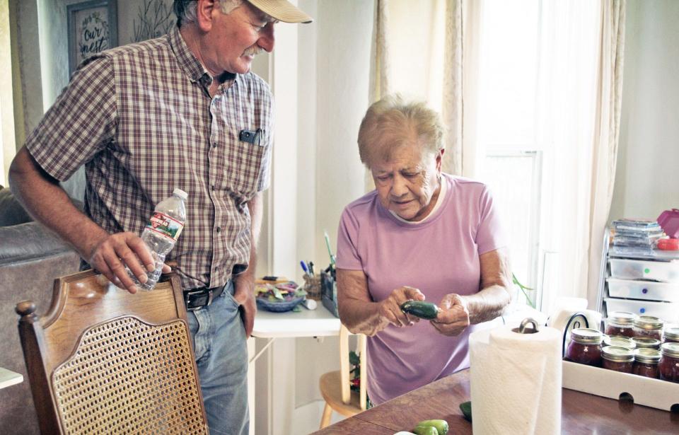 Professor Mike Bartolo (left) and Inez Cruz talk peppers.