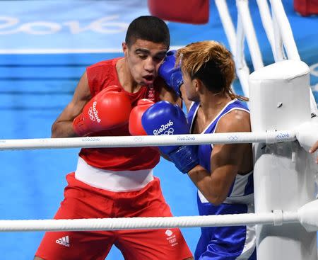 Aug 15, 2016; Rio de Janeiro, Brazil; Yoel Segundo Finol (VEN, blue) fights Muhammad Ali (GBR, red) in a men's fly preliminary bout at Riocentro - Pavilion 6 during the Rio 2016 Summer Olympic Games. Mandatory Credit: John David Mercer-USA TODAY Sports