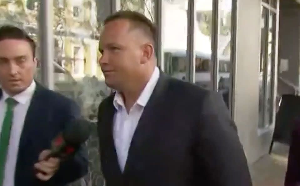 Matthew Scown was filmed smirking outside court on Wednesday. Source: 7 News