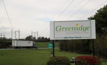 A semi truck passes the entrance to the Greenridge Generation power plant, Friday, Oct. 15, 2021, in Dresden, N.Y. One Bitcoin mining operation in central New York came up with a novel solution in finding cheap energy to run the power-gobbling computer arrays that create and transact cryptocurrency: It took over Greenidge Generation which now produces about 44 megawatts to run 15,300 computer servers, plus additional electricity it sends into the state's power grid. (AP Photo/Julie Jacobson)