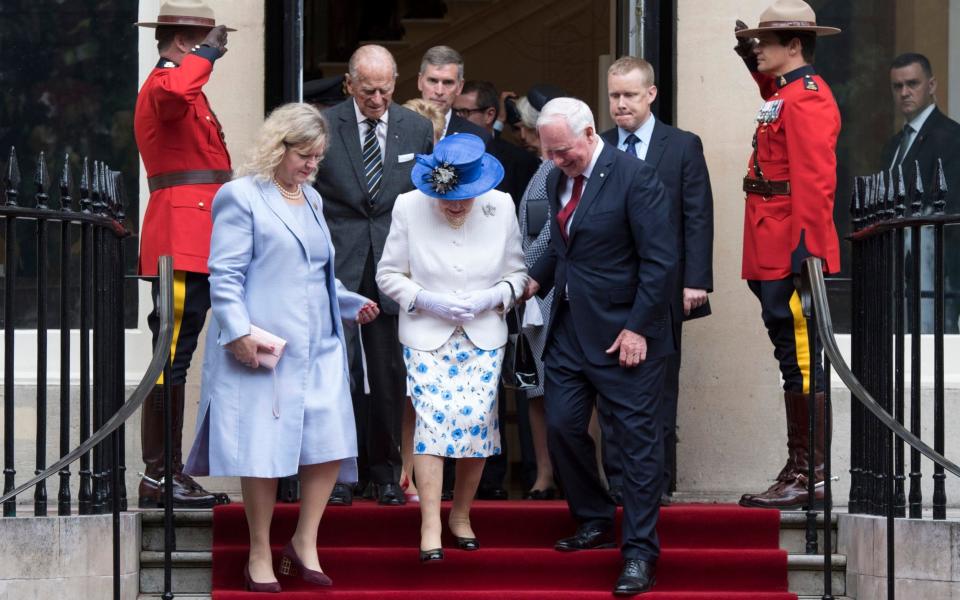The Queen, accompanied by Prince Philip, Duke of Edinburgh (C-L) attended a function at Canada House - Credit: EPA/WILL OLIVER